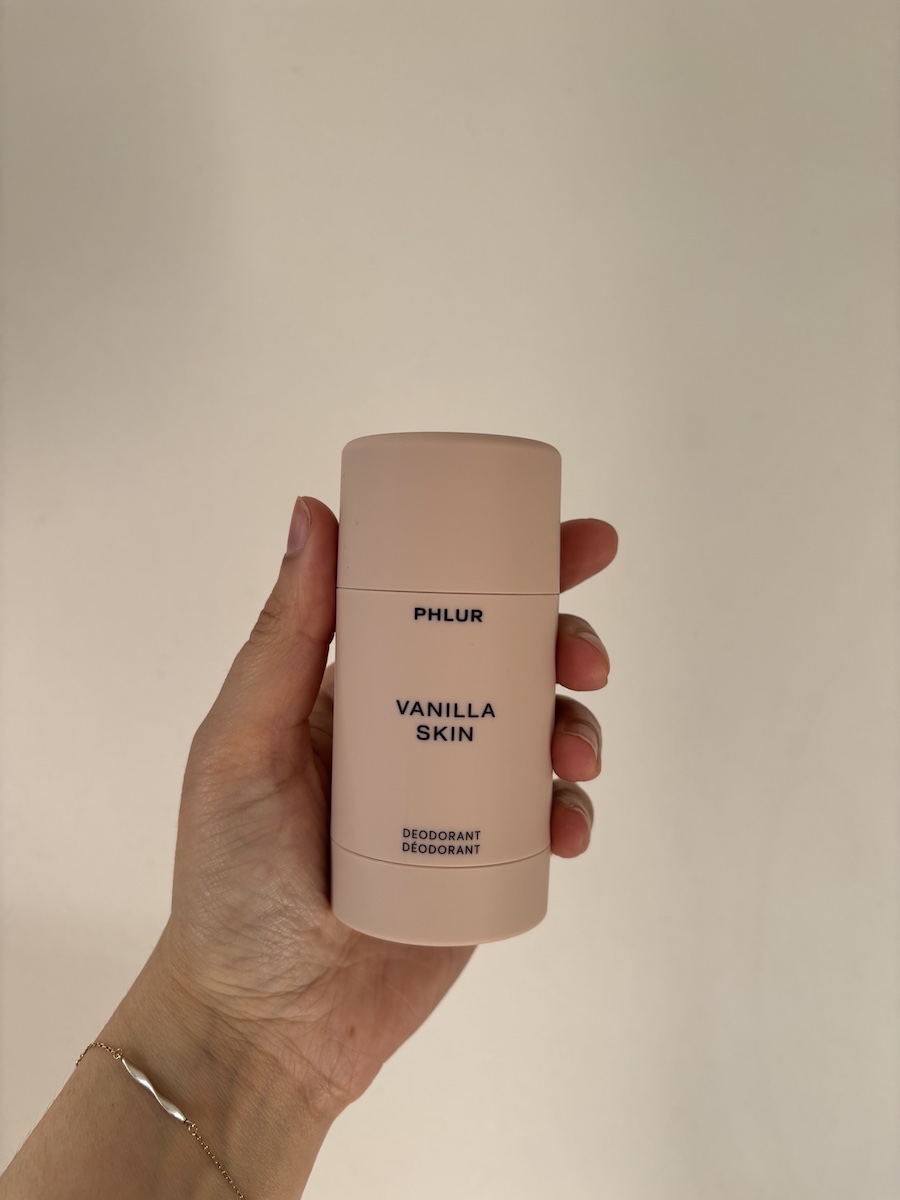 Mica Ricketts holding Phlur Vanilla Skin Deodorant