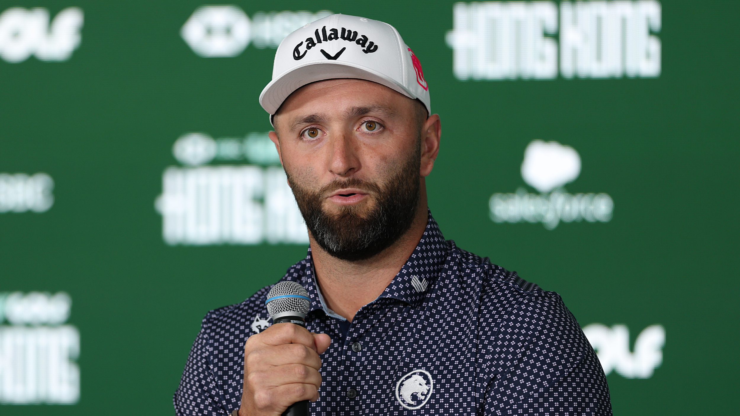 Jon Rahm talks to the media