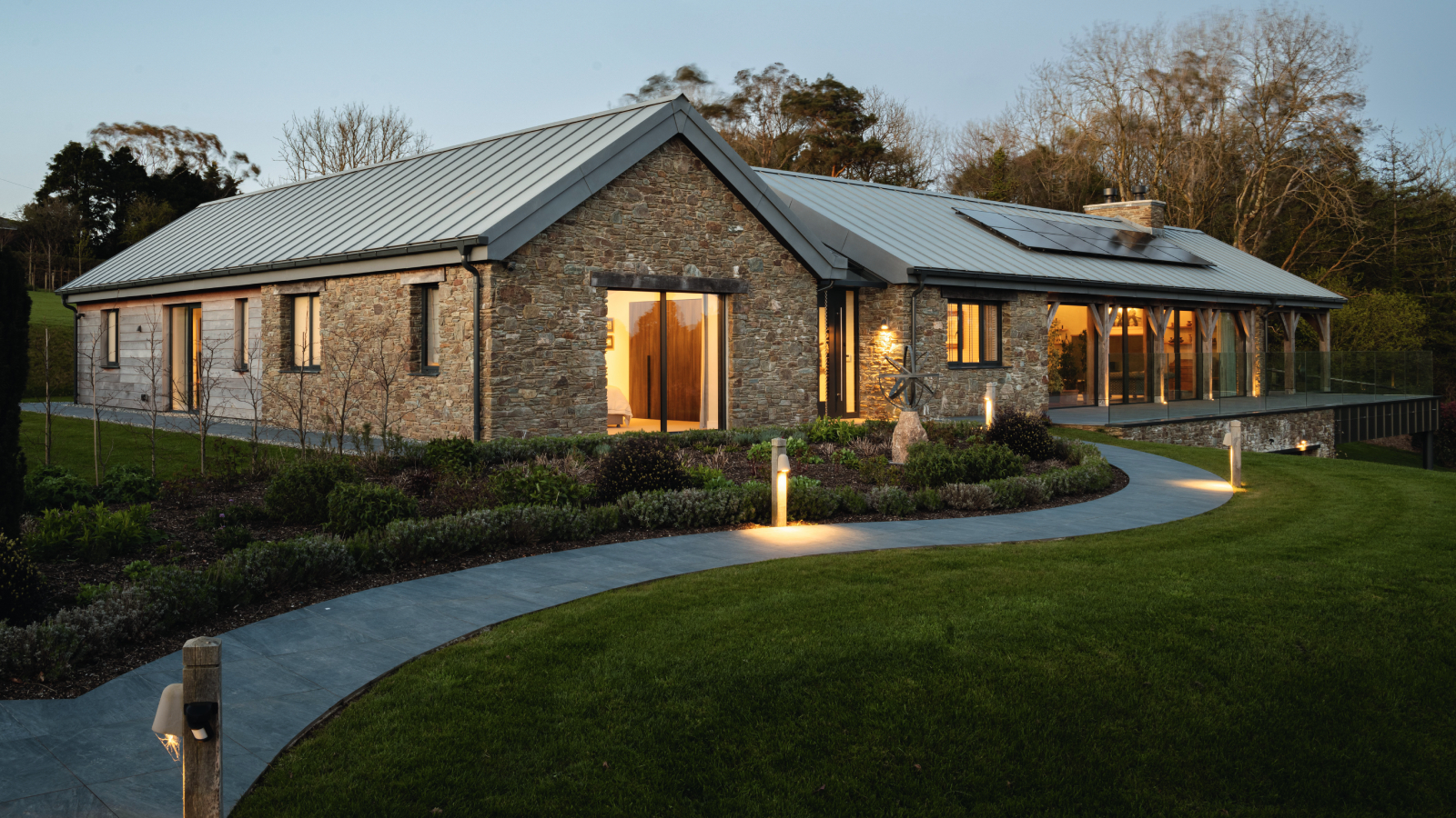single storey oak frame home with brick and timber cladding