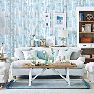 living room blue wallpaper wall sofa and frame