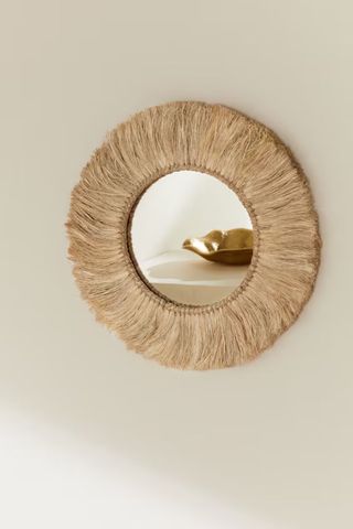 Mirror with a straw frame