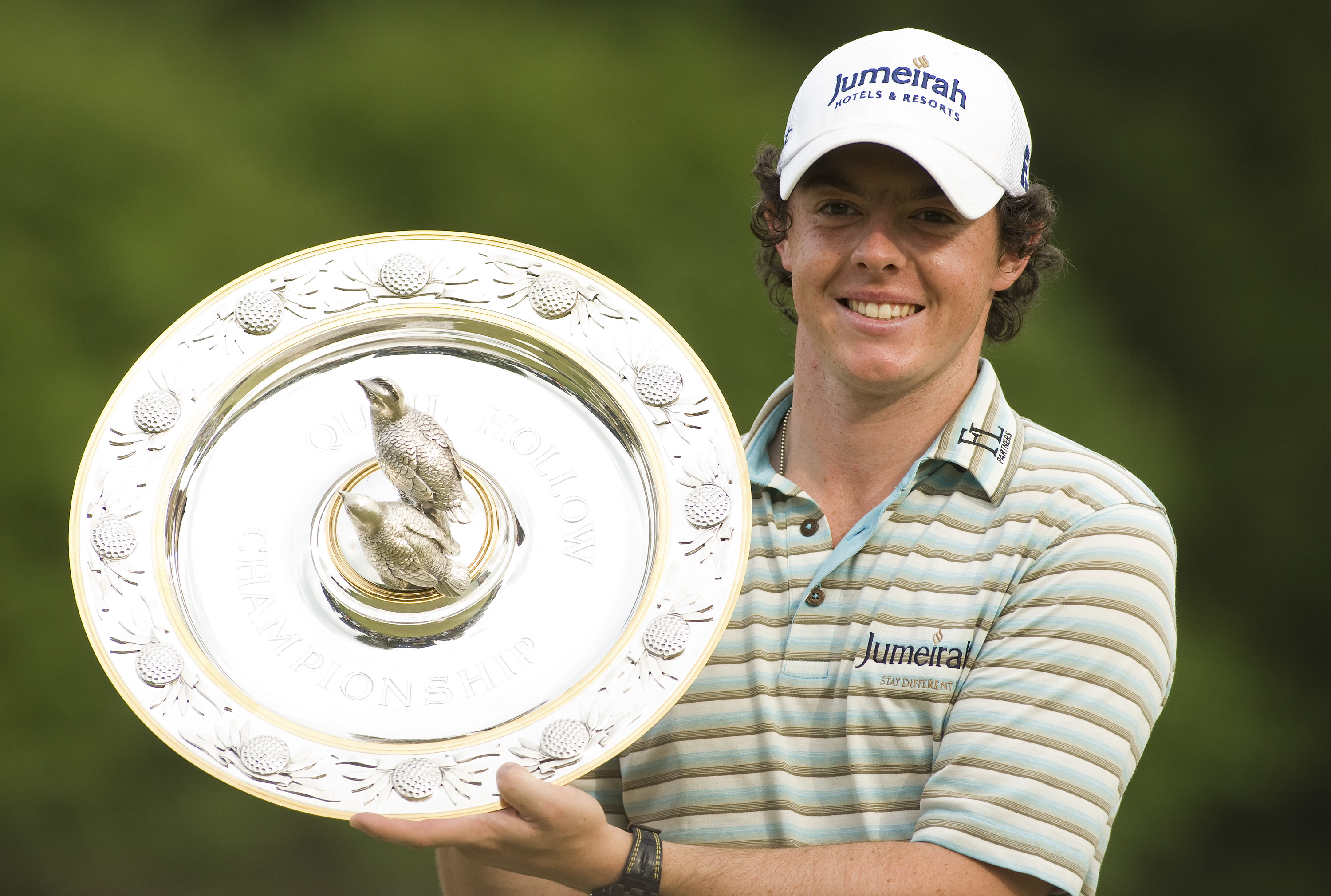 Rory McIlroy holds up the 2010 Quail Hollow Championship trophy