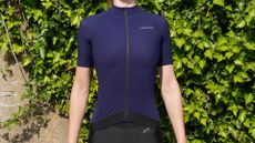 Female cyclist wearing the Jelenew Glider Short Sleeve Pro Jersey