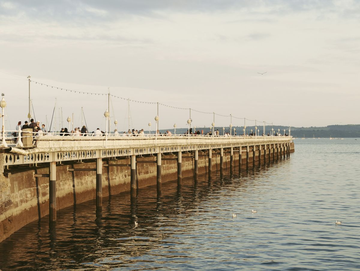 Sample image taken with the Panasonic Lumix L10; a pier at golden hour, with calm seas