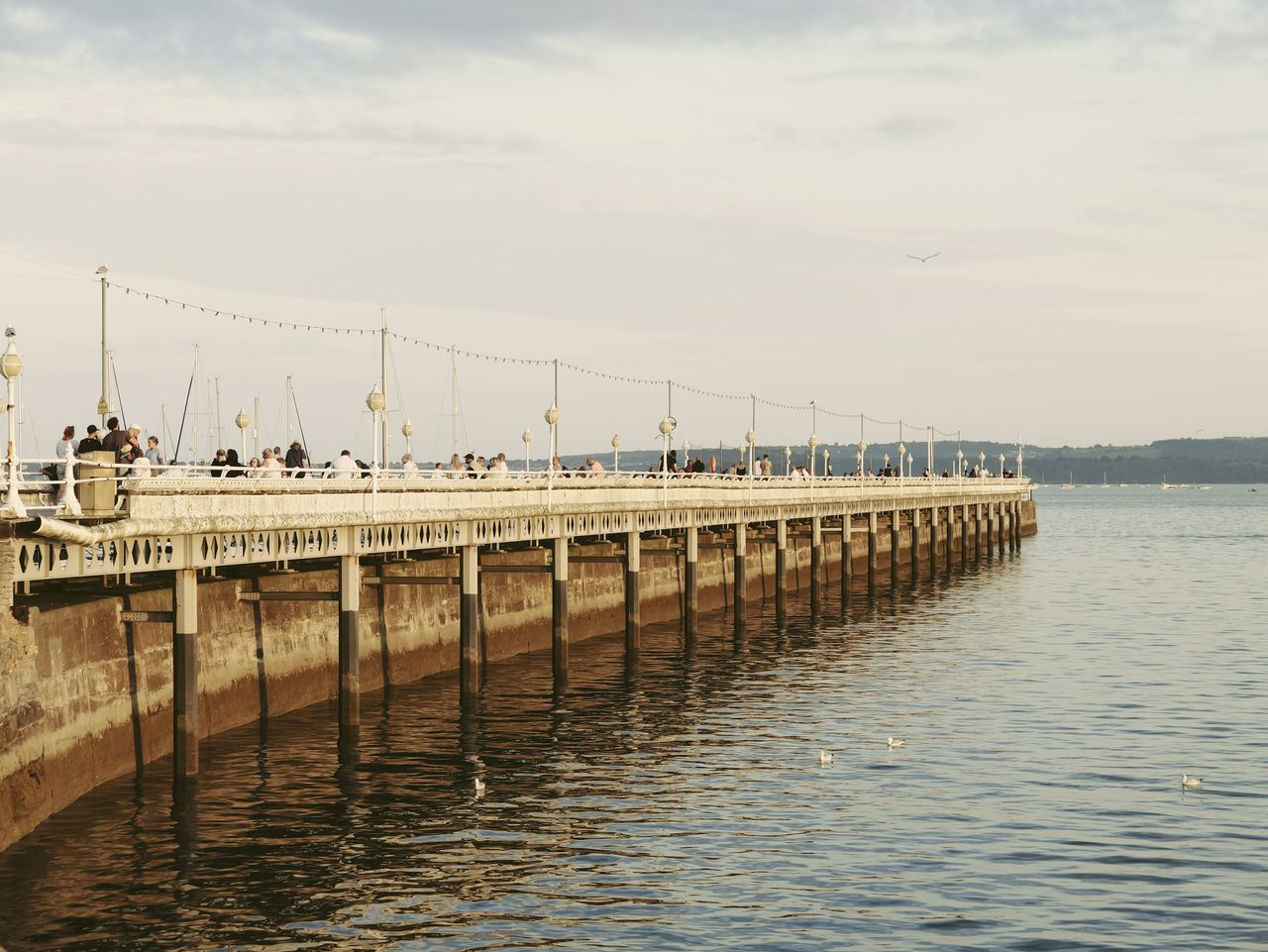 Sample image taken with the Panasonic Lumix L10; a pier at golden hour, with calm seas