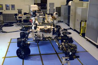 At 10 feet (3 meters) long, Mars Science Laboratory has been likened to the size of a Mini Cooper. Curiosity is about twice as long and five times as heavy as NASA's twin Mars Exploration Rovers, Spirit and Opportunity, which launched in 2003 and are s