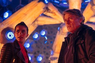 Yaz (Mandip Gill) and Dan (John Bishop) on board the TARDIS, looking apprehensive