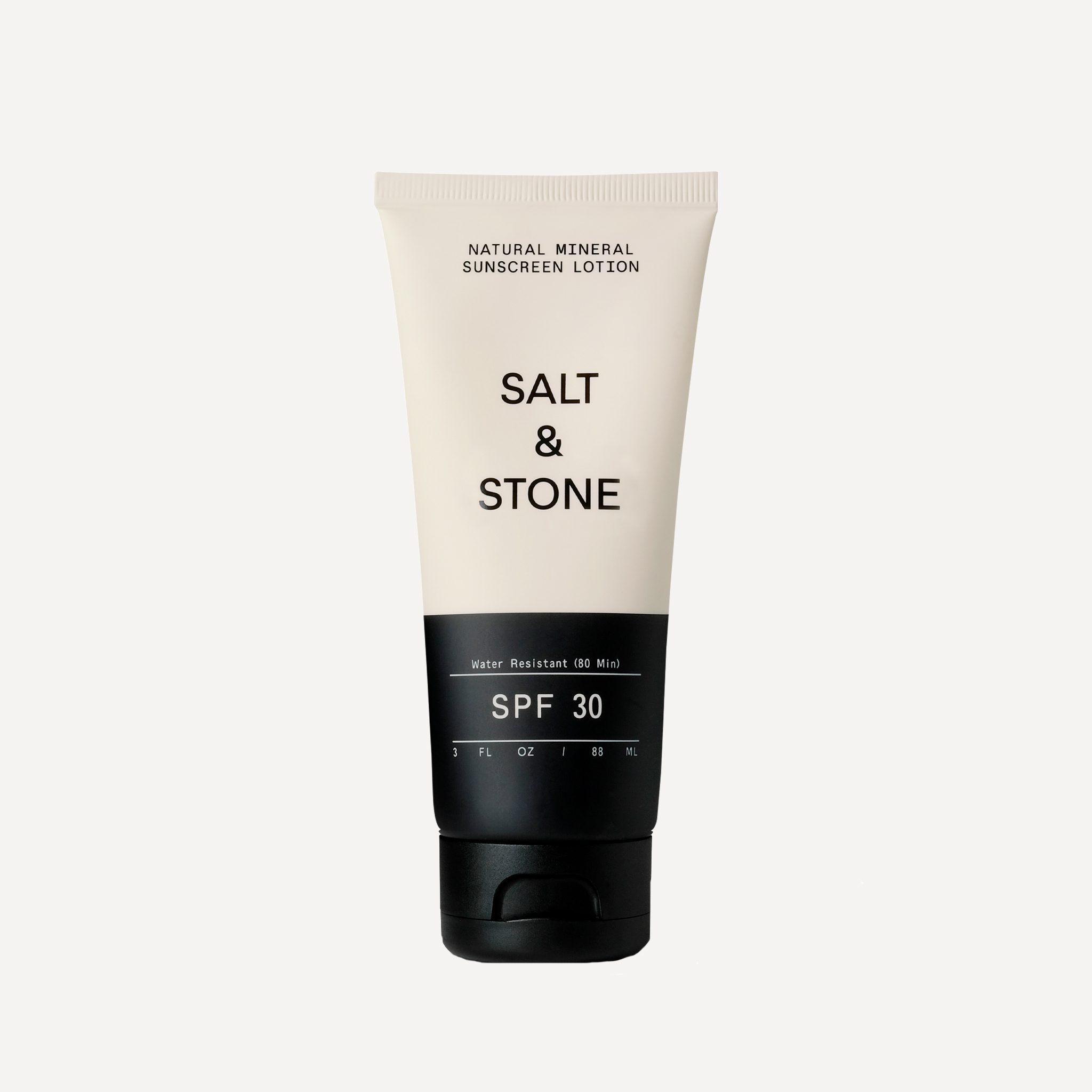 Salt and stone organic sunscreen in black and white bottle