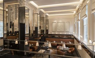 Le Dame De Pic Restaurant with toffee coloured leather and tinted mirrors, London