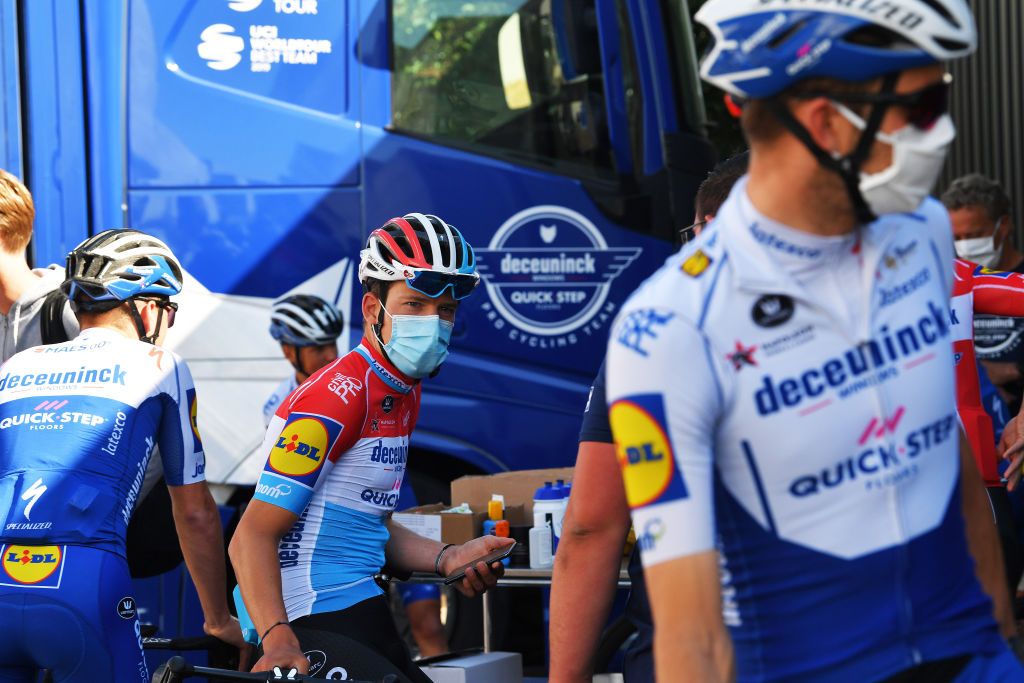 Bob Jungels wears a face mask before the training ride rolls out