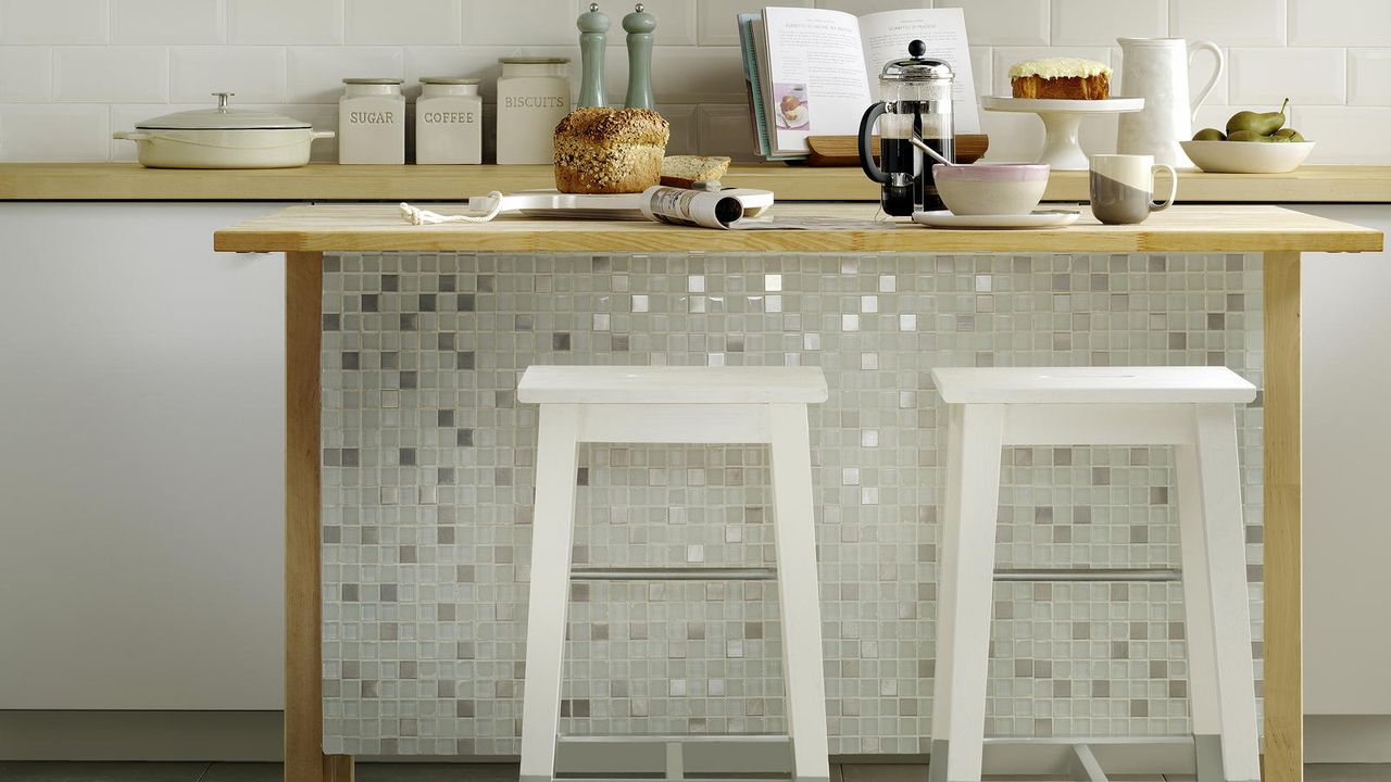 tiled kitchen island with painted bar stools