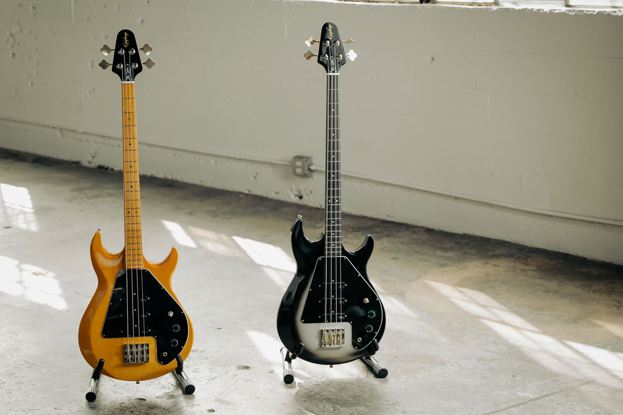 The Epiphone Mike Dirnt G-3 Grabber is an affordable replica of his original Gibson and features a trio of Gibson USA pickups, custom wiring, and is available in Natural and Silverburst finishes.