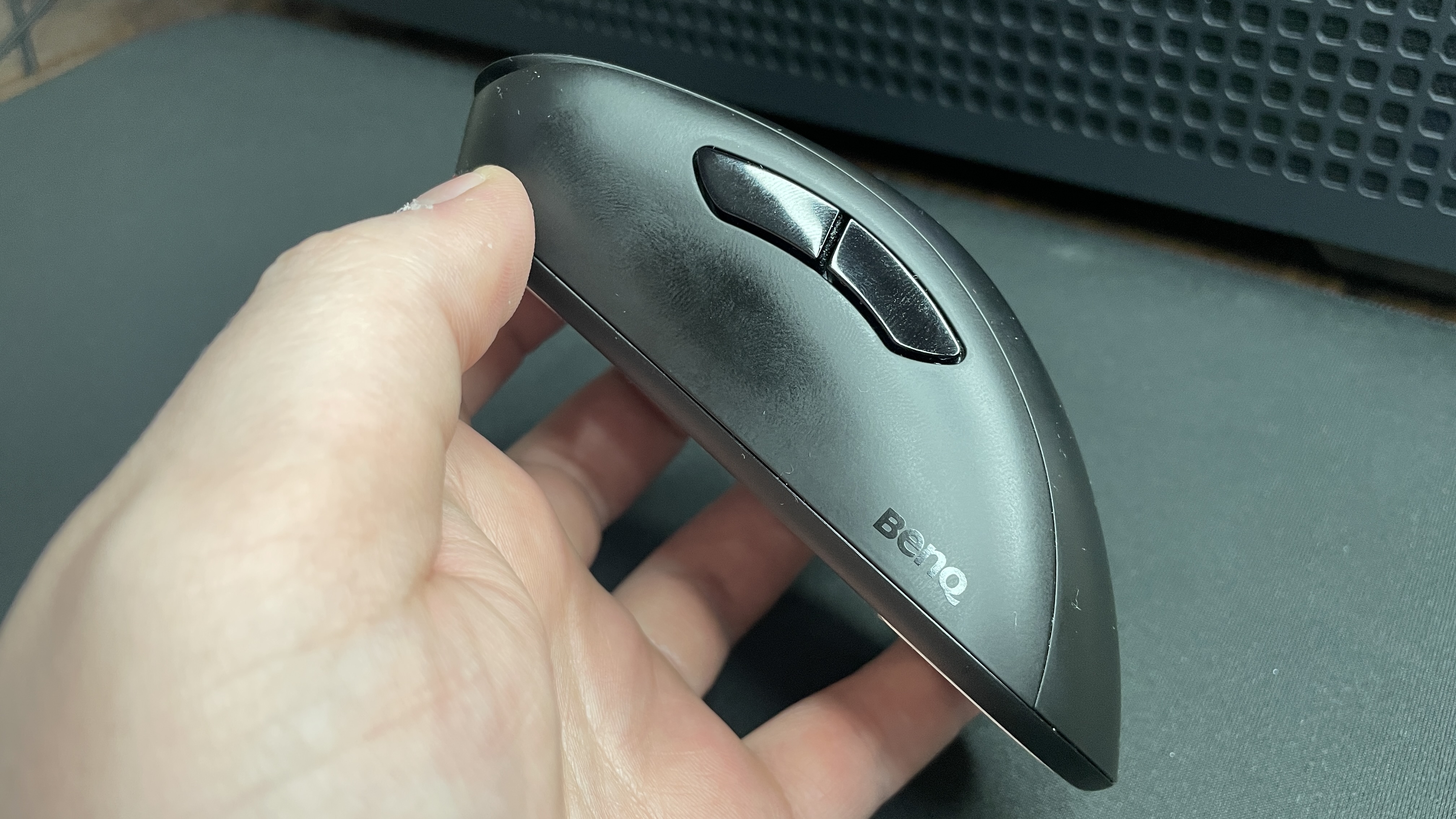 A Zowie EC2-DW gaming mouse with a thumbprint on the side.