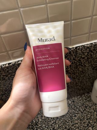 Marisa holding the Murad AHA/BHA Exfoliating Cleanser