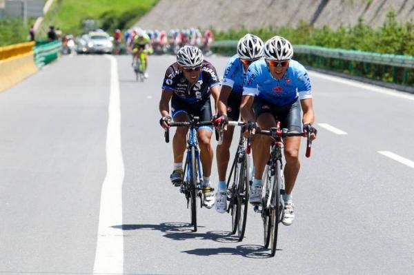 Hossein Askari (Tabriz) leads a three man escape group nearing the crest of the climb.