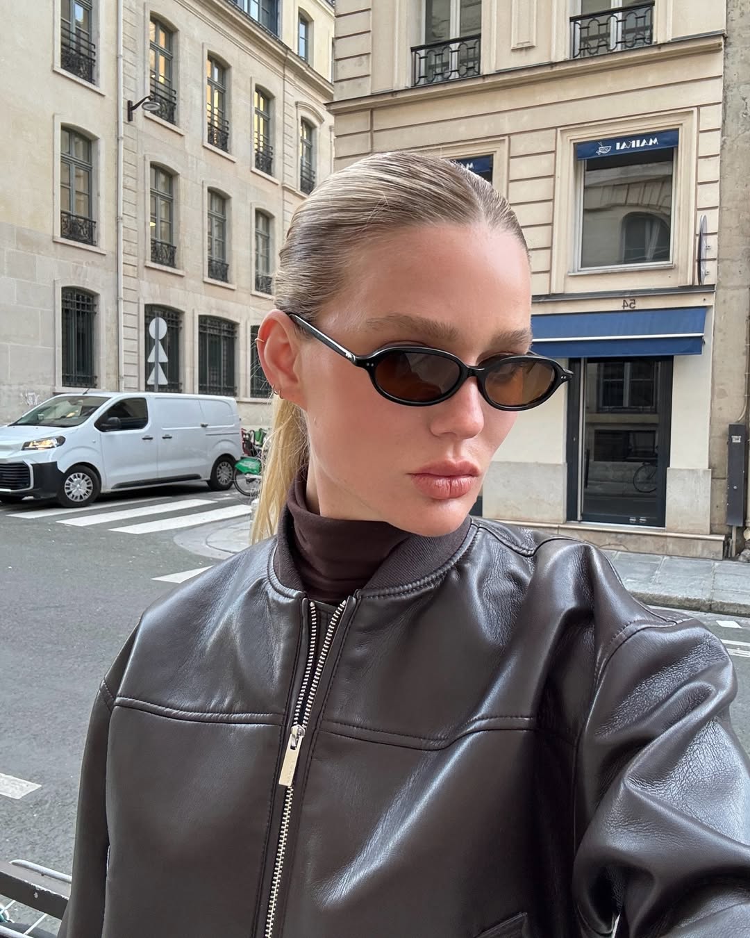 Megan Adelaide wearing a sleek, ponytail