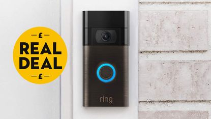 All-new Ring Doorbell on white brick wall with Real Deal badge