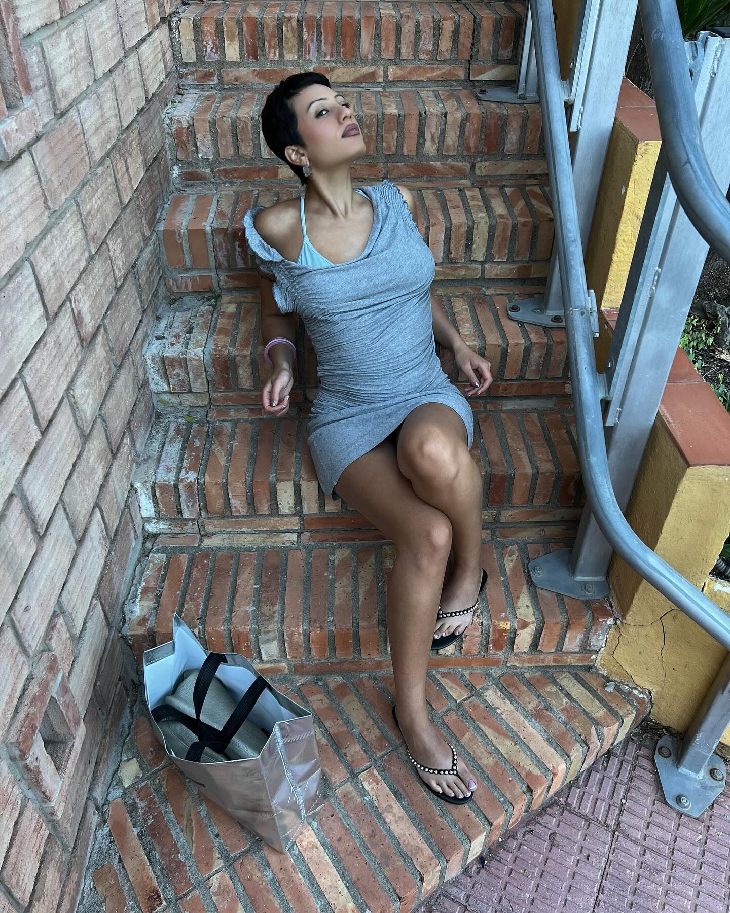 @g_yasein wears studded flip flops