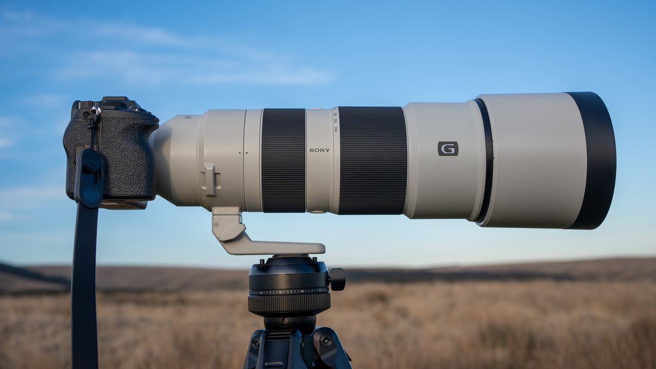 Sony FE 200-600 f/5.6-6.3 G OSS on a tripod in a field