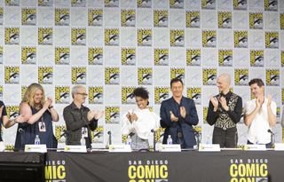 The cast and crew of "Star Trek: Discovery" applaud during the show's Comic-Con 2017 panel in San Diego on July 22, 2017. They are (from left to right); Executive Producer, Gretchen J. Berg; Executive Producer, Alex Kurtzman; Sonequa Martin-Green; Jason Isaacs; Doug Jones; and James Frain
