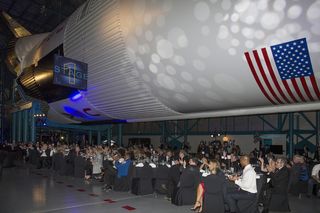 The Apollo 11 anniversary gala was held at NASA’s Kennedy Space Center, underneath a Saturn V booster.