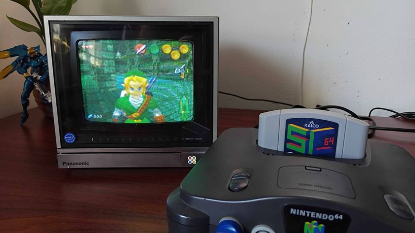 Nintendo 64 console with SummerCart64 inserted on desk with Panasonic CRT TV and Zelda: Ultimate Trial hack on screen.