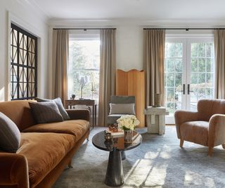 A neutral living room designed by Nate Berkus Associates