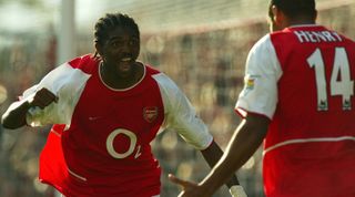 LONDON - 21 SEPTEMBER: Nwankwo Kanu of Arsenal celebrates his late winner during the FA Barclaycard Premiership match between Arsenal and Bolton Wanderers at Highbury in London on September 21, 2002. Arsenal won 2-1. (photo By Ben Radford/Getty Images)
