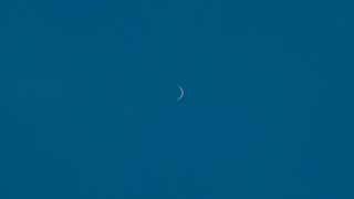 Venus as a razor-thin crescent as it nears inferior conjunction with the sun.