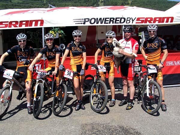 Cal Britten, Katherine O'Shea, Jo Wall, Tory Thomas, "Maple" the Australian Cattle Dog, Rob Eva, enjoying the sunshine outside the SRAM tent at Mont Sainte Anne, Quebec.
