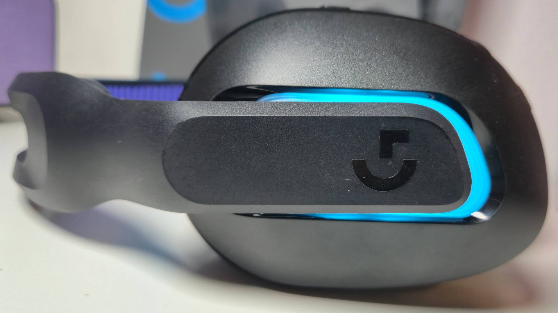 Photo by Rosalie Newcombe of a close up of the side of the Logitech G522 Lightspeed headset.