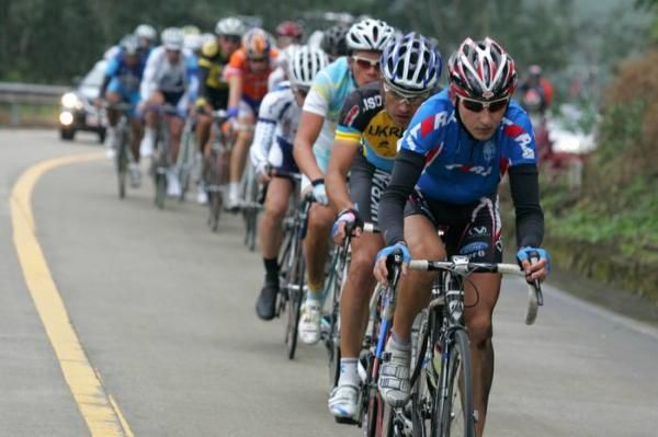 Sergey Firsanov (Russia) leads the main group up the main climb of the day.