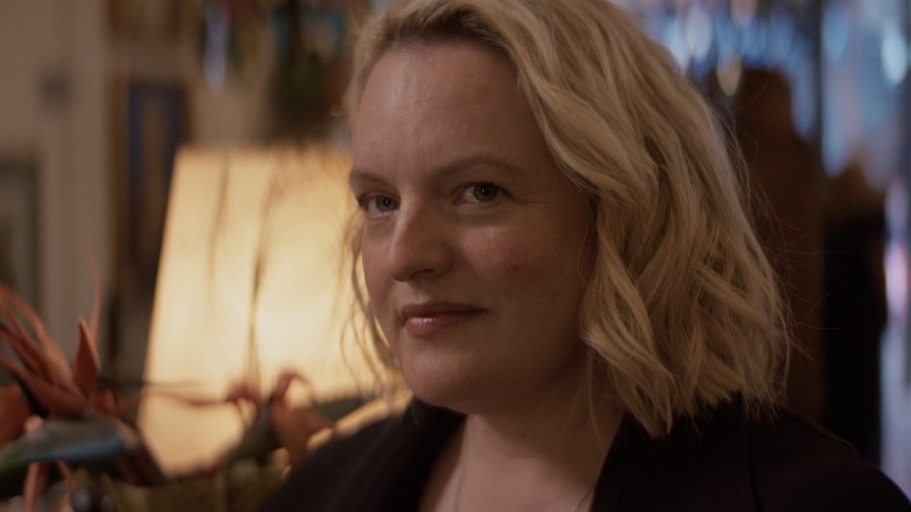 June smiling watching Daisy in The Testaments Episode 1.