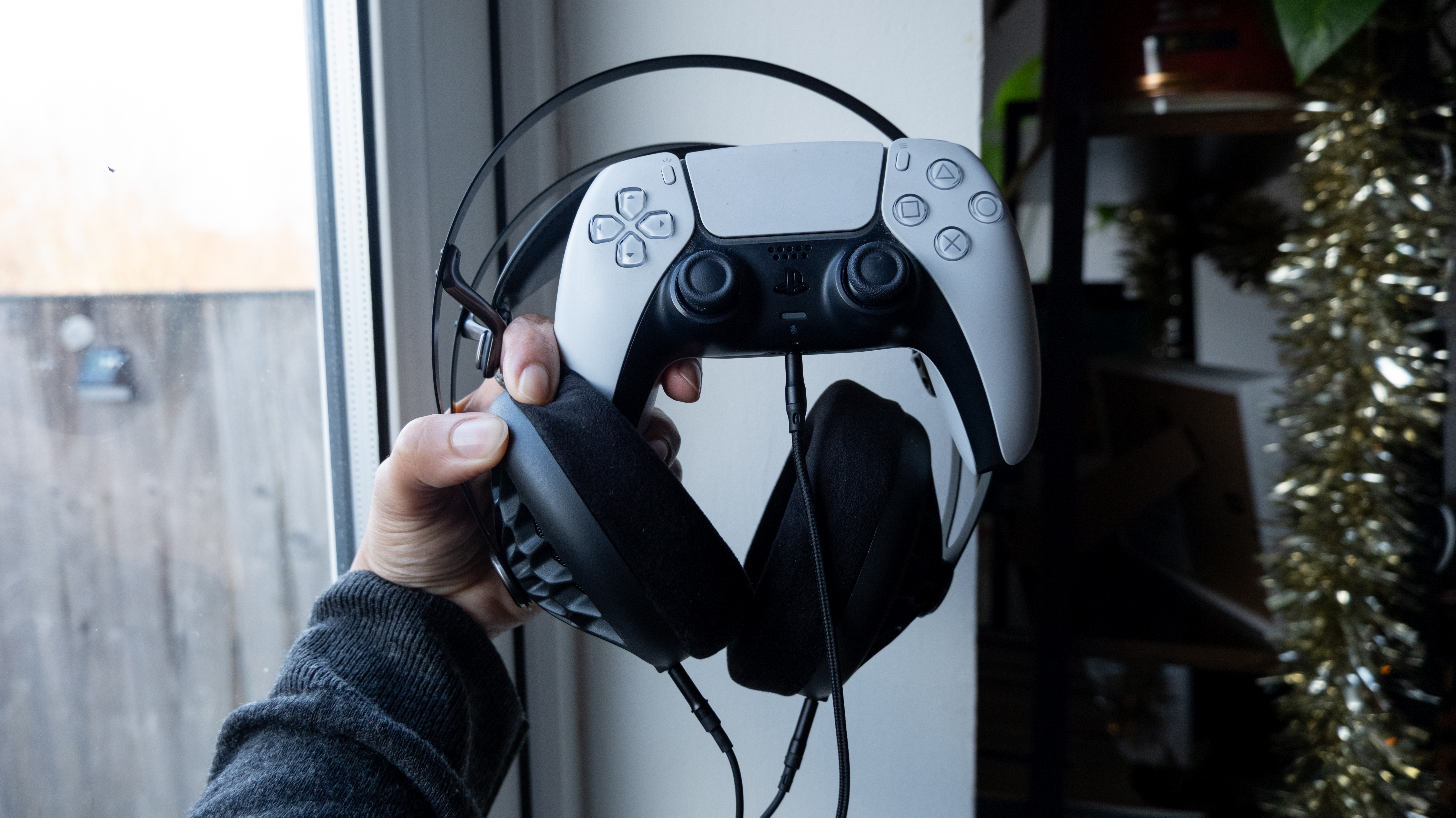 Meze 105 AER wired headphones being used with a PS5 Slim