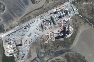Maxar Technologies' WorldView-3 satellite captured this image of SpaceX's Starbase site in South Texas on Aug. 9, 2021. Two Starship Super Heavy boosters are visible in the image: Booster 3 at left and the 29-engine Booster 4 at right.