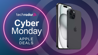 An iPhone 15 on a circular background next to a sign saying Cyber Monday Apple deals