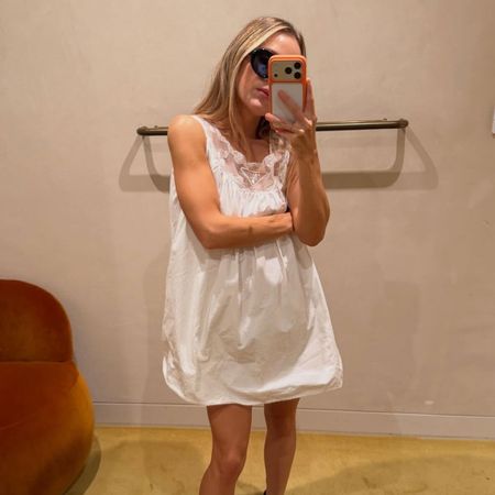 @rachelle.rowlings mirror selfie wearing white prada sleep style dress