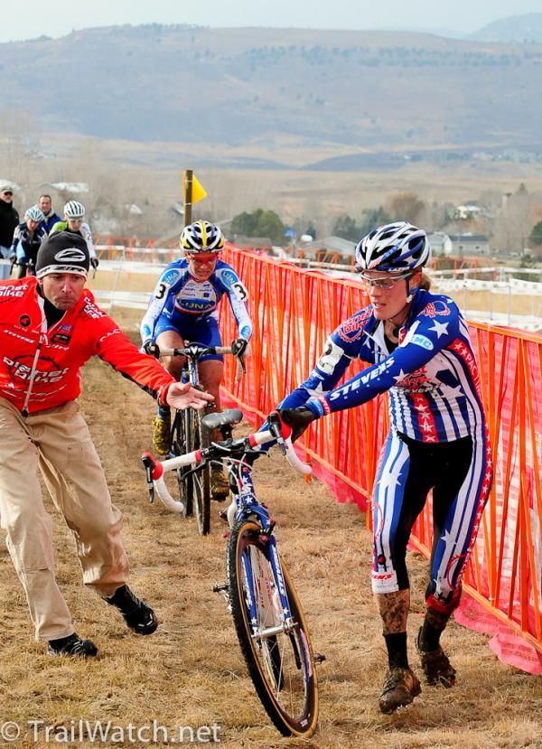 Compton gets a bike from her pit crew/husband Mark Legg.