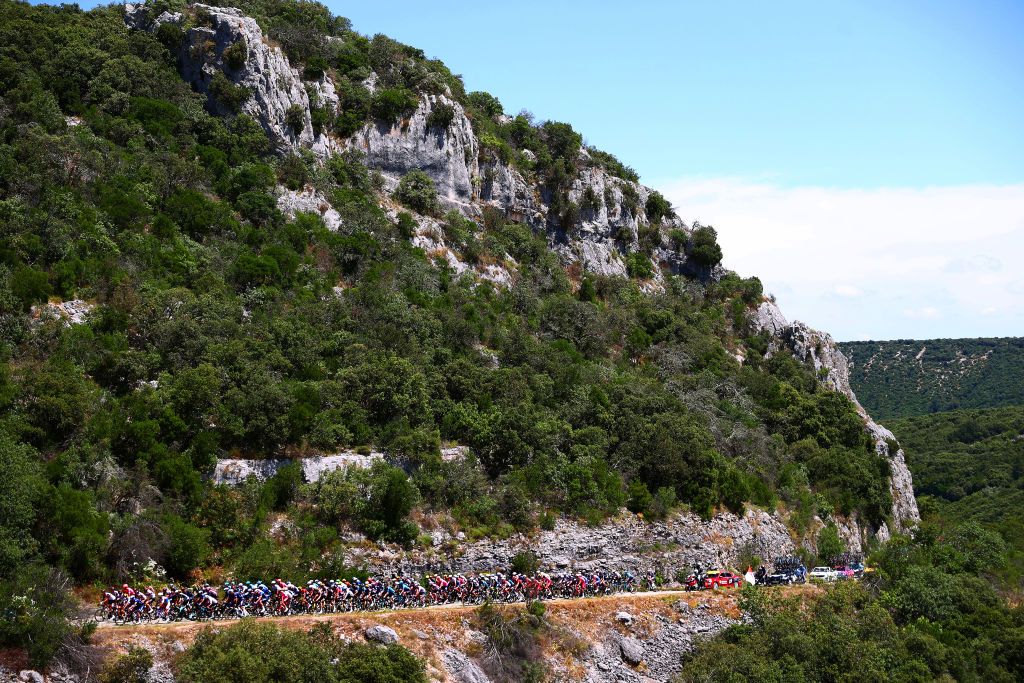 NMES FRANCE JULY 08 The Peloton passing through a Landscape of Fond Ponchon Bidon during the 108th Tour de France 2021 Stage 12 a 1594km stage from SaintPaulTroisChateaux to Nimes LeTour TDF2021 on July 08 2021 in Nmes France Photo by Michael SteeleGetty Images