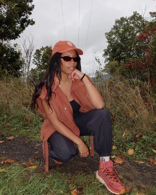 Woman wearing hiking clothing.