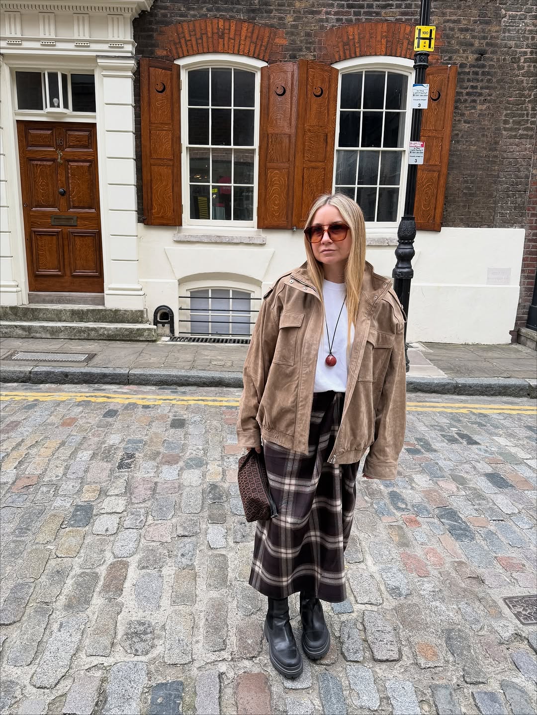 woman wearing plaid maxi skirt outfit 2025