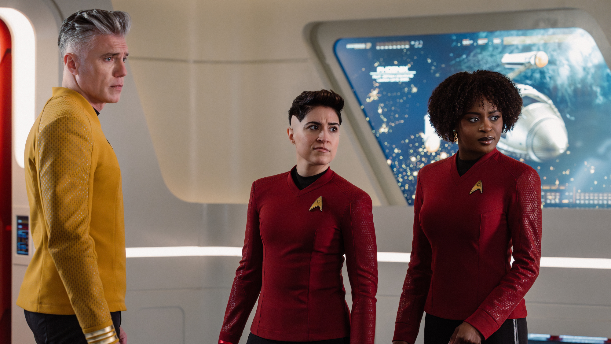 L-R: Anson Mount as Captain Pike, Melissa Navia as Lt. Erica Ortegas, and Celia Rose Gooding as Uhura, in Star Trek: Strange New Worlds, episode 6, season 4.