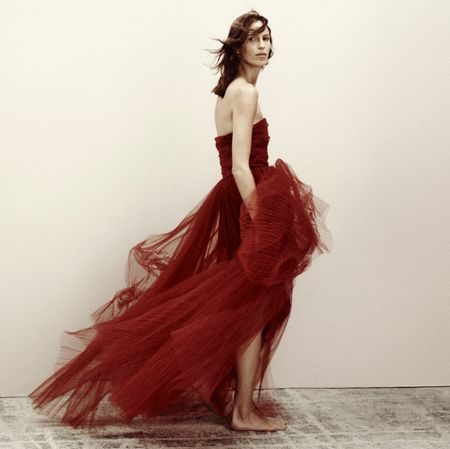 Woman in a red gown from HM Studio Holiday Collection 2023