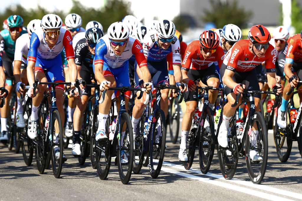 REGGIO EMILIA ITALY MAY 18 LR Tobias Ludvigsson of Sweden Clement Davy of France and Team Groupama FDJ Pieter Serry of Belgium and Team QuickStep Alpha Vinyl and Matthew Holmes of United Kingdom and Team Lotto Soudal lead the peloton compete during the 105th Giro dItalia 2022 Stage 11 a 203km stage from Santarcangelo di Romagna to Reggio Emilia Giro WorldTour on May 18 2022 in Reggio Emilia Italy Photo by Michael SteeleGetty Images