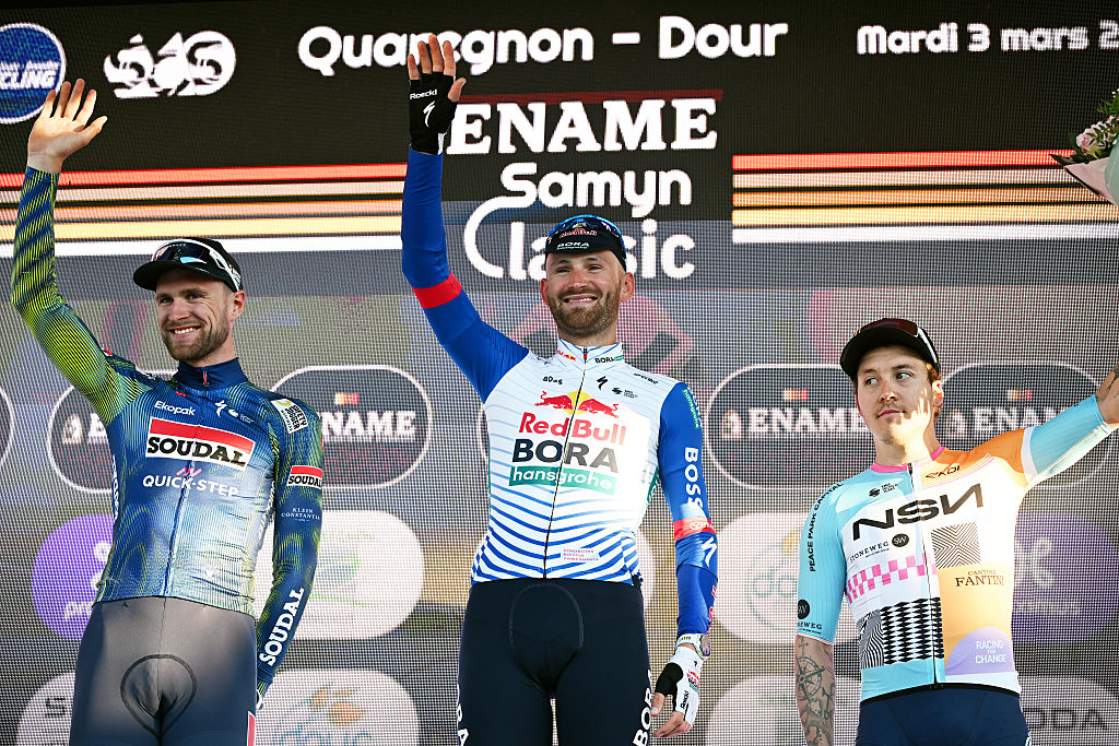 DOUR, BELGIUM - MARCH 03: (L-R) Laurenz Rex of Belgium and Team Soudal Quick-Step on second place, race winner Jordi Meeus of Belgium and Team Red Bull - BORA - hansgrohe and Hugo Hofstetter of France and Team NSN Cycling on third place pose on the podium ceremony after the 58th Ename Samyn Classic 2026 - Men&amp;amp;apos;s Elite a 203.8km one day race from Quaregnon to Dour on March 03, 2026 in Dour, Belgium. (Photo by Luc Claessen/Getty Images)