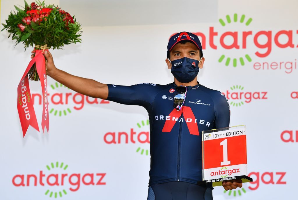Team Ineos rider Ecuadors Richard Carapaz celebrates his combativity prize at the end of the 16th stage of the 107th edition of the Tour de France cycling race 164 km between La Tour du Pin and VillarddeLans on September 15 2020 Photo by Stuart Franklin POOL AFP Photo by STUART FRANKLINPOOLAFP via Getty Images