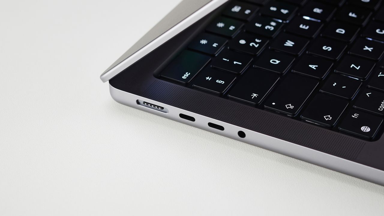 MacBook Pro 14-inch on a table in an office