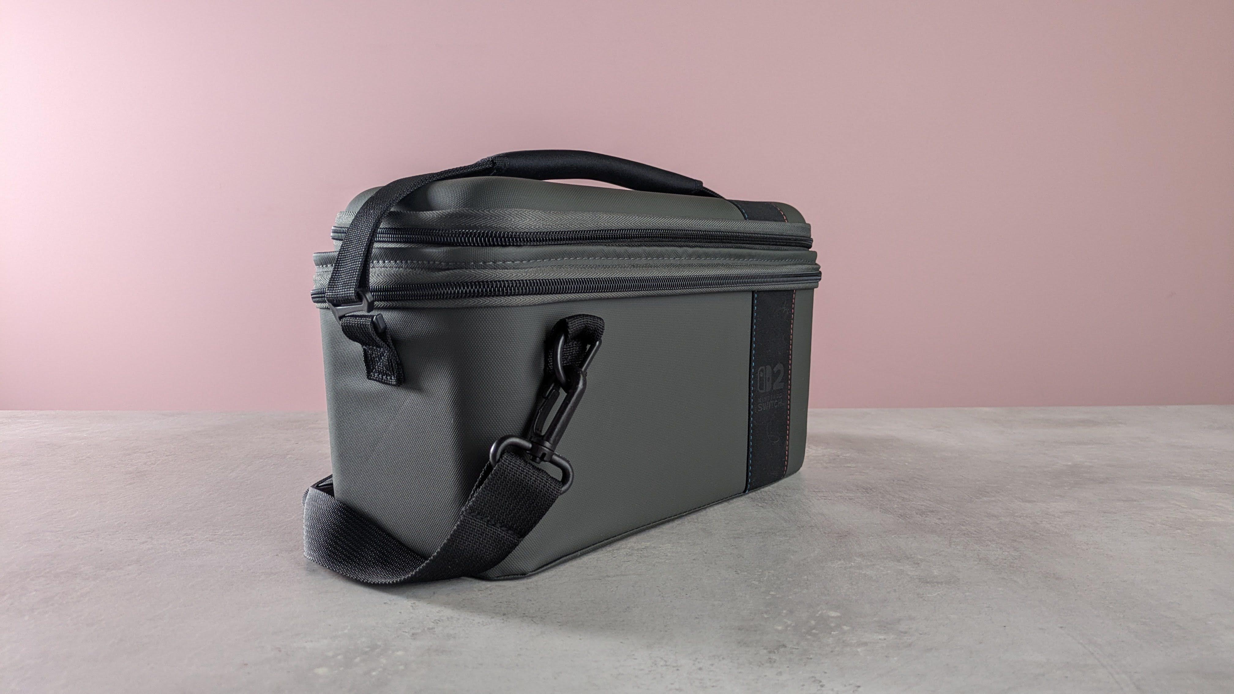 Three-quarter view of Turtle Beach PlayTrek 2-in-1 Case for Nintendo Switch 2 on a desk with pink wall in background