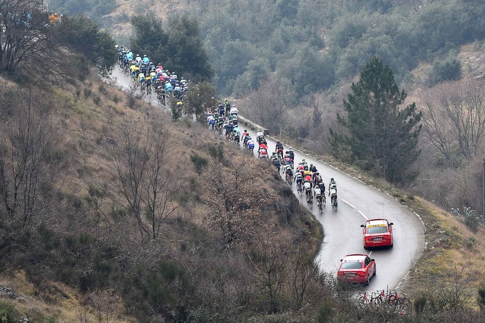 The pack rolls through the French hills.