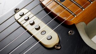 Closeup of an electric guitar pickup on a Fender Stratocaster